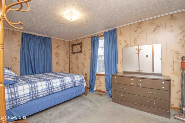 carpeted bedroom with a textured ceiling