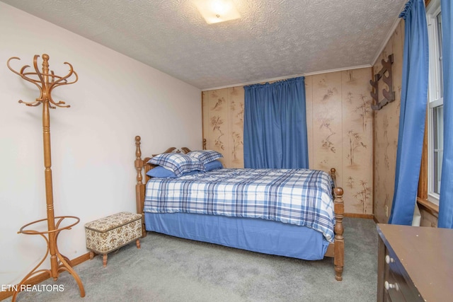 carpeted bedroom featuring a textured ceiling