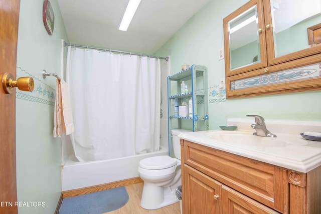 full bathroom featuring wood-type flooring, vanity, toilet, and shower / bath combo with shower curtain