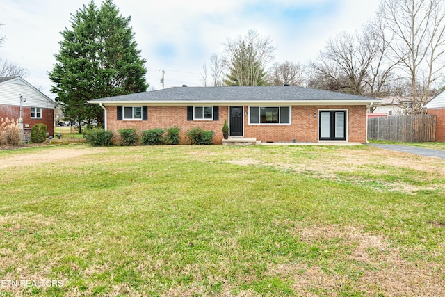 ranch-style house featuring a front lawn