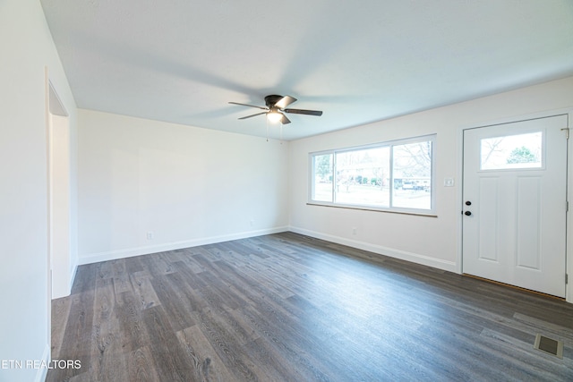 interior space with ceiling fan and dark wood-type flooring