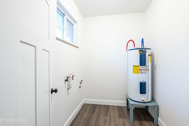 interior space with hardwood / wood-style floors and electric water heater