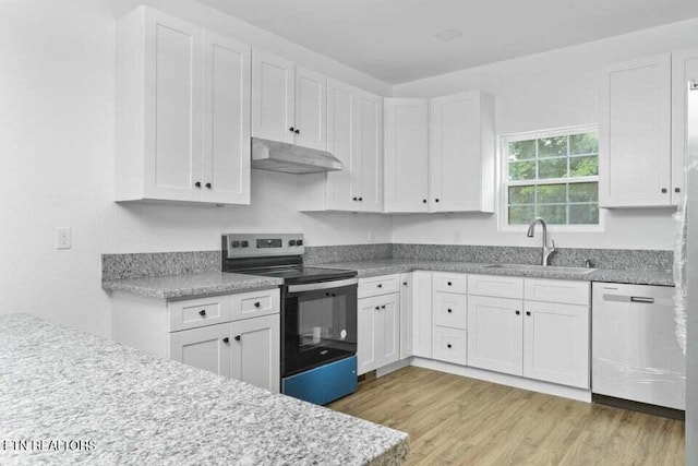 kitchen featuring sink, white cabinets, light hardwood / wood-style flooring, and appliances with stainless steel finishes