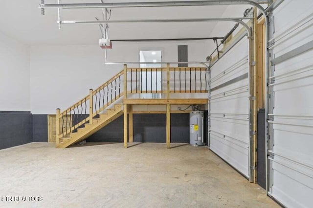 garage with electric water heater and a garage door opener