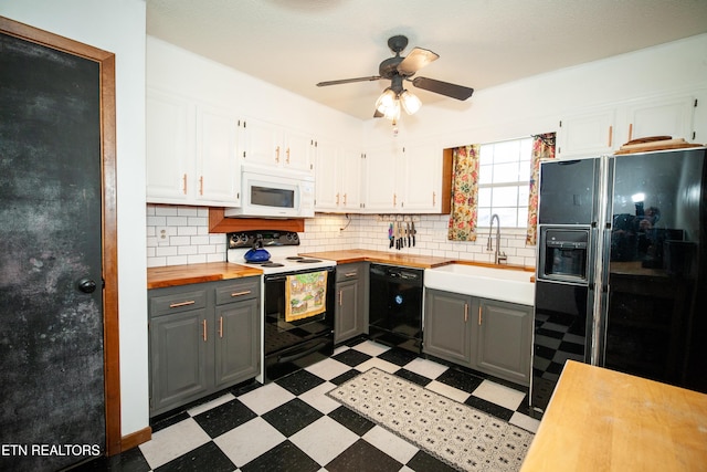 kitchen with white cabinetry, sink, gray cabinetry, decorative backsplash, and black appliances