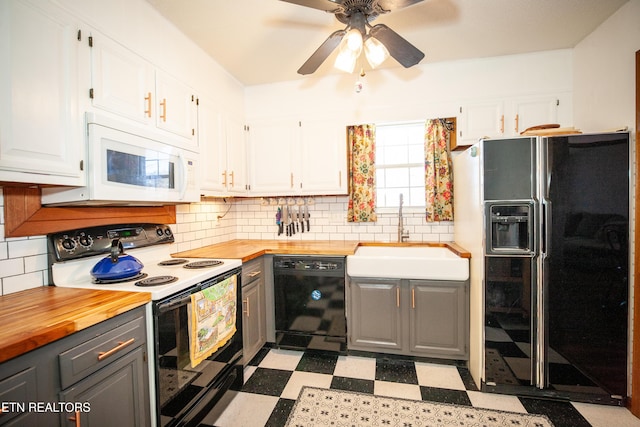 kitchen with sink, wooden counters, gray cabinetry, black appliances, and white cabinets