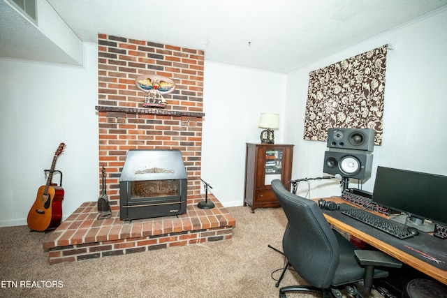 office space with ornamental molding, a fireplace, and carpet floors