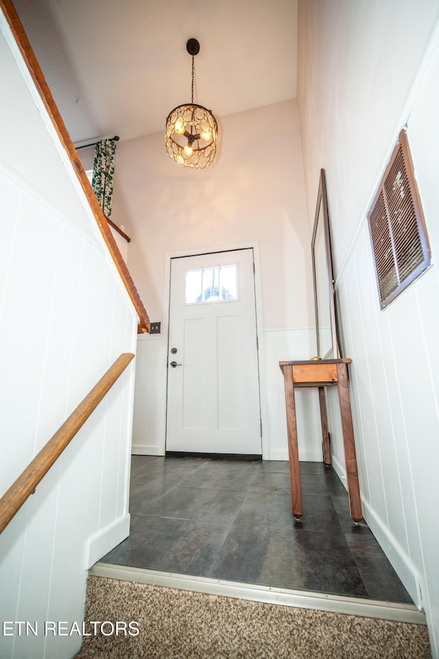 foyer featuring a high ceiling