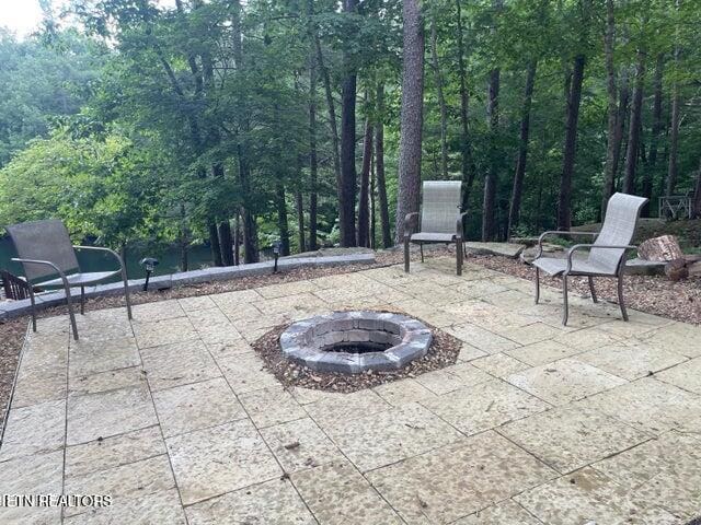 view of patio with an outdoor fire pit