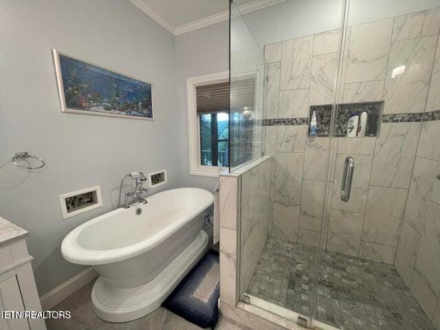 bathroom featuring vanity, baseboards, ornamental molding, a soaking tub, and a stall shower