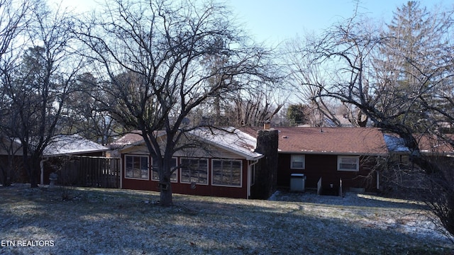 back of house with a sunroom