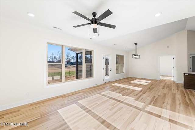 unfurnished living room with light hardwood / wood-style floors, vaulted ceiling, and ceiling fan