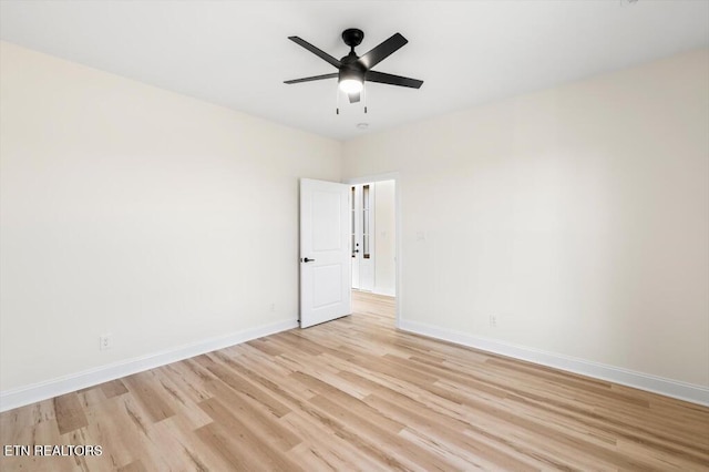 spare room featuring ceiling fan and light wood-type flooring