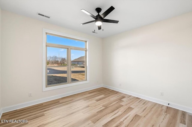 unfurnished room featuring ceiling fan and light hardwood / wood-style flooring