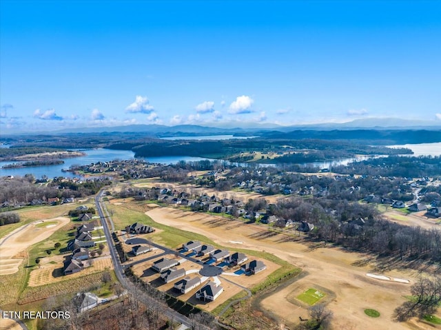 bird's eye view with a water and mountain view