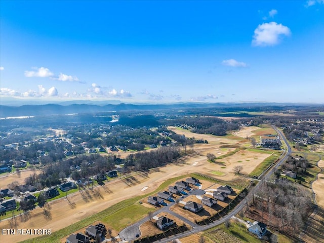 birds eye view of property with a mountain view