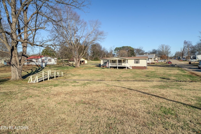 view of yard featuring a wooden deck