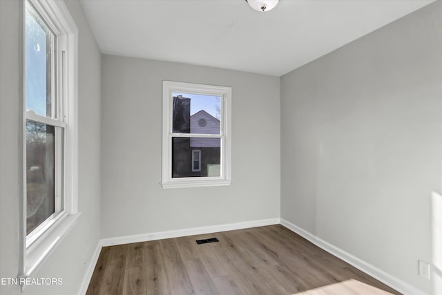 spare room featuring light wood-type flooring