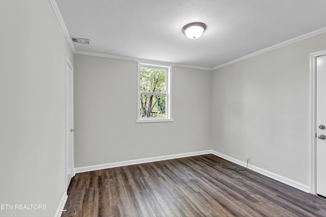 unfurnished room featuring ornamental molding and dark hardwood / wood-style floors