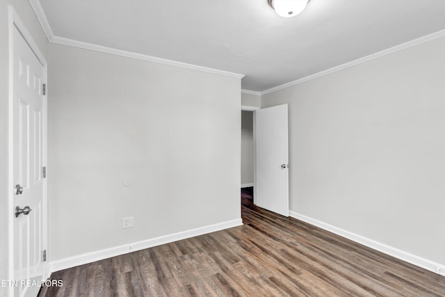 unfurnished bedroom with dark wood-type flooring and crown molding