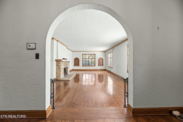 hallway featuring crown molding and wood-type flooring