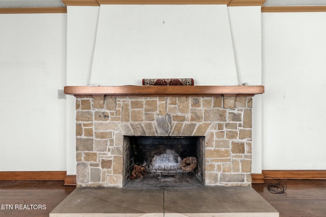 interior details featuring wood-type flooring and a fireplace