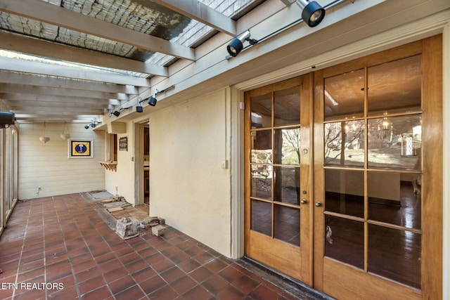 view of patio featuring french doors