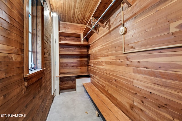 view of sauna featuring concrete floors