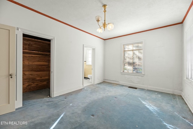 unfurnished bedroom featuring a notable chandelier and ornamental molding