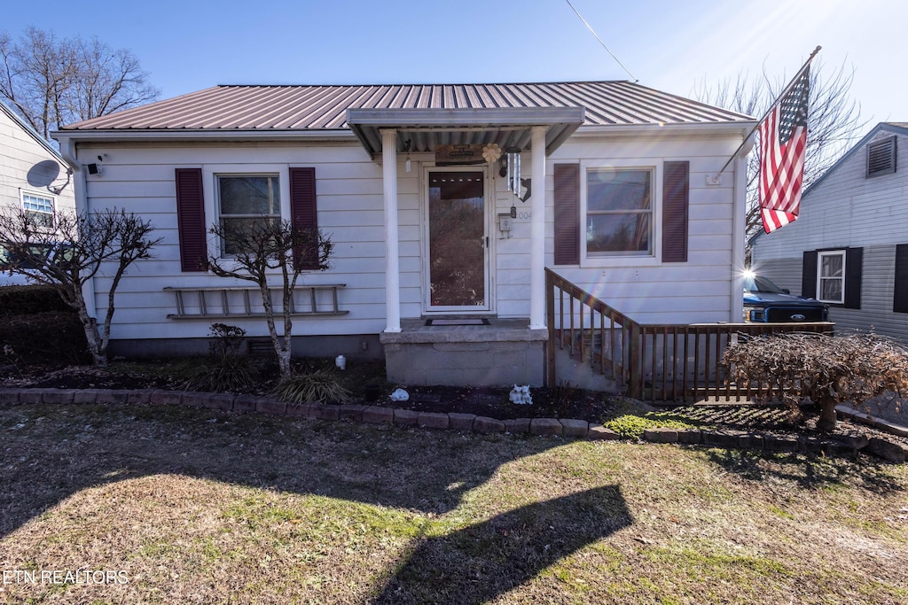 bungalow with a front lawn