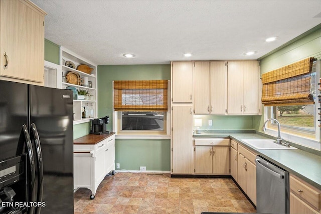 kitchen featuring black fridge with ice dispenser, light brown cabinetry, stainless steel dishwasher, and sink