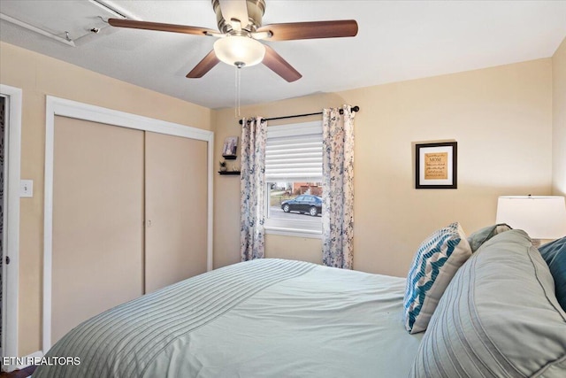 bedroom with a closet and ceiling fan