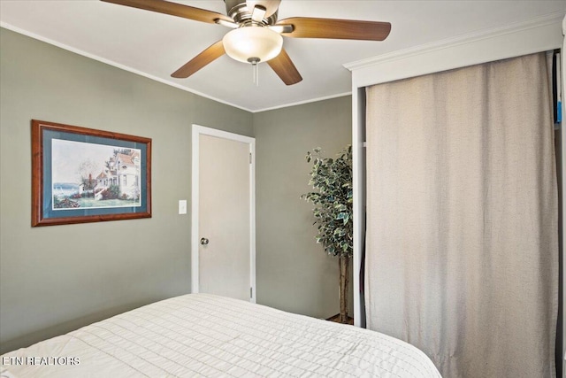 bedroom featuring ceiling fan and ornamental molding