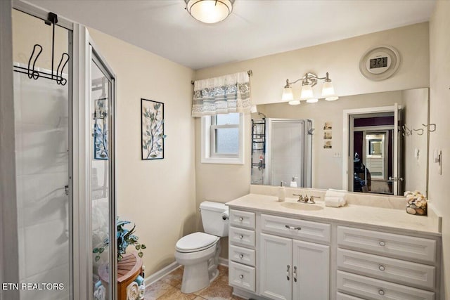 bathroom with tile patterned floors, toilet, walk in shower, and vanity