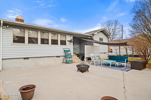 exterior space with an outdoor living space with a fire pit