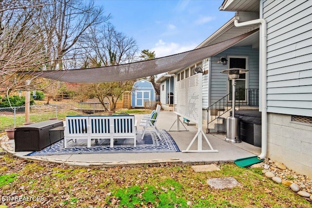 exterior space with a patio area and a storage unit