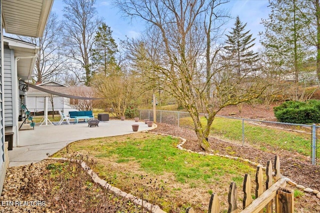 view of yard featuring an outdoor living space and a patio area