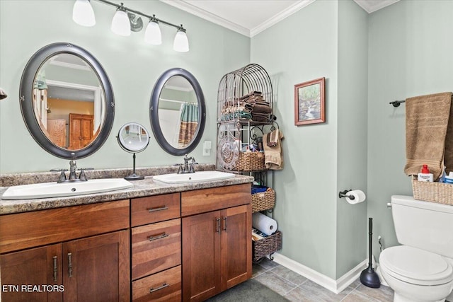 bathroom featuring toilet, vanity, ornamental molding, and tile patterned flooring