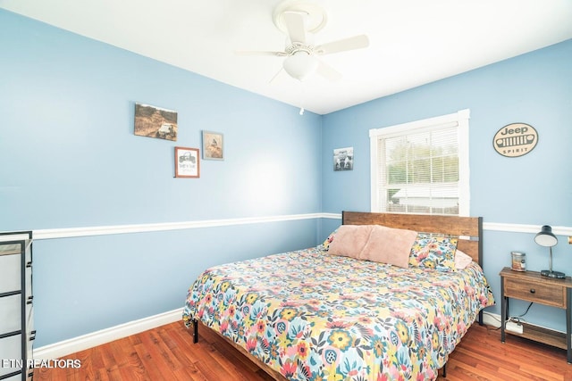 bedroom featuring hardwood / wood-style flooring and ceiling fan