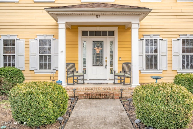 property entrance featuring covered porch