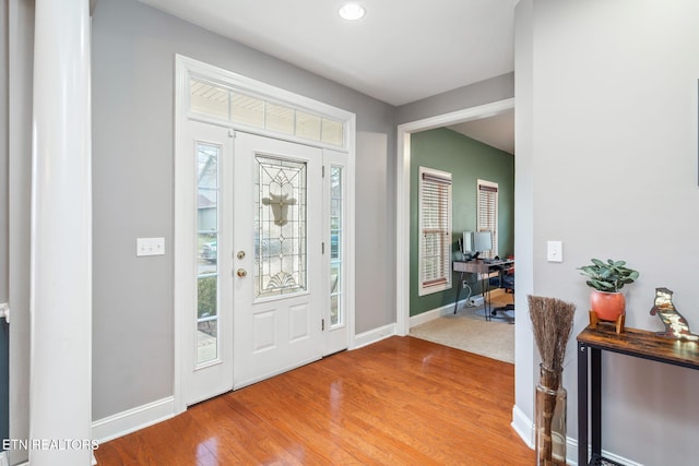 foyer entrance with light hardwood / wood-style flooring