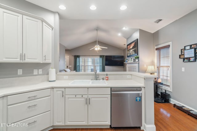 kitchen featuring kitchen peninsula, stainless steel dishwasher, ceiling fan, sink, and white cabinets