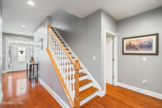 staircase featuring hardwood / wood-style flooring