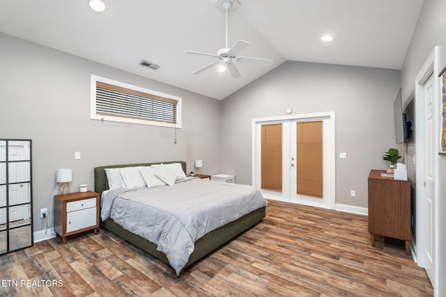 bedroom featuring ceiling fan, french doors, dark hardwood / wood-style floors, and lofted ceiling