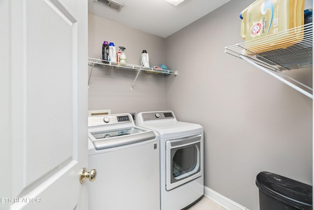 washroom with washing machine and dryer