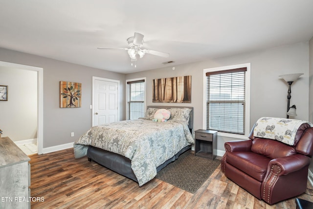 bedroom featuring wood-type flooring and ceiling fan