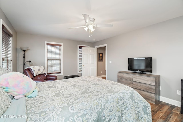 bedroom with ceiling fan and dark wood-type flooring