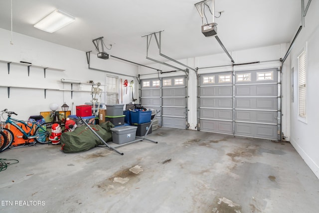 garage featuring a garage door opener