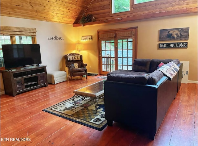 living room featuring wooden ceiling, wood-type flooring, and vaulted ceiling