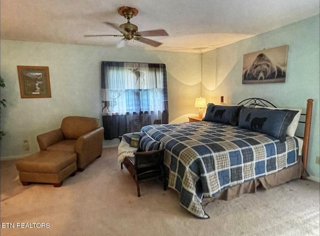 bedroom featuring ceiling fan and carpet floors